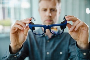 In smart glasses waveguides operate in transparent lenses to transmit digital content to the user’s field of vision. Photo: SCHOTT