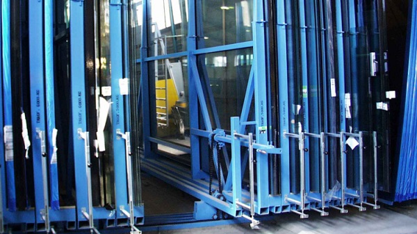 Manual compact storage system for glass. Operators can easily move individual storage racks as they are on a special track system.