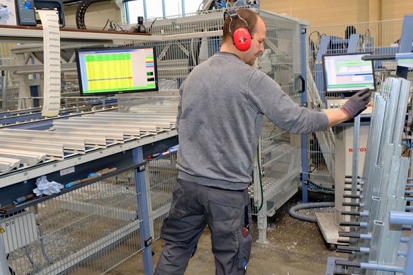 Inserting reinforcements in the processing center. All information is displayed on large, clear monitors.