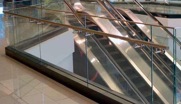 Structural laminated glass railings enhance safety and shopper experience.