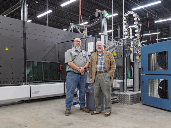 © LiSEC; Chris Jonely (AMSCO Equipment Specialist, left) and Curtis Liposcak (LiSEC Sales, right) in front of the VSA machine on the Velocity line