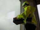 Sparklike Laser Portable being used on a window