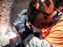 A Nortex Glass & Mirror employee wears a safety shield while working.