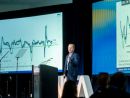 Connor Lokar presenting from the Keynote Theater at GlassBuild 2026
