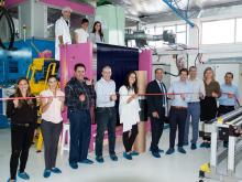 Gauzy CEO Eyal Peso cuts the ribbon to launch Gauzy’s SPD-Smart light control film production line with Joseph M. Harary, CEO of Research Frontiers, while select members of Gauzy’s senior management and board of directors look on.