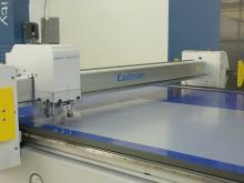 Cutting EVA laminated glass with Eastman C125 Conveyor system