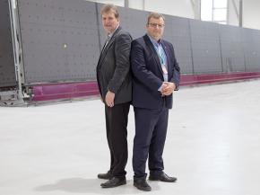 Hannu and Markku Hautanen, owners of Skaala, in front of a new LiSEC IG line being installed 