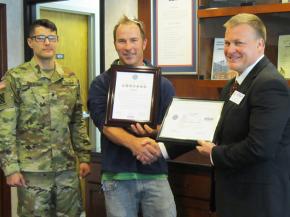 Spc. Andrew Jimenez; Linetec's production supervisor for paint applications, Tom Danen; and ESGR representative, Dave Monk