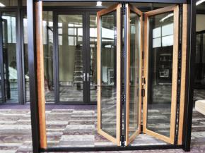 Inside Solar: Wood Veneer Vinyl-Composite Folding Glass Wall