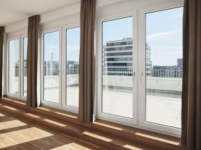 View from one of the five penthouse apartments with roof terrace. The profiles of the window doors have been kept neutral on the room side (Schüco Corona SI 82 system).