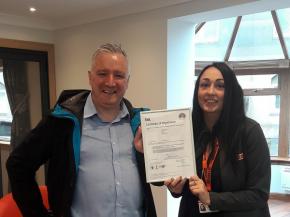 Robert Fitzpatrick, Group accreditations Manager-HSQE for Sidey and Haylee Lilley, Sales & Showroom Manager, with the new ISO certificate.