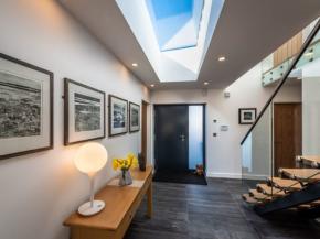 Frameless rooflights helps accentuate the open plan contemporary style of this new build dwelling