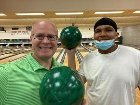 Chris Kammer, A+W Marketing Coordinator North America (left) along with Davison, a Big Brothers Big Sisters protégé, during a visit to the bowling center.