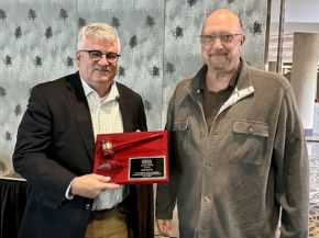 Immediate Past Chair Ron Crowl (left), receives a recognition award from 2024-25 term Chair, Rick Locke (right).
