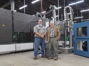© LiSEC; Chris Jonely (AMSCO Equipment Specialist, left) and Curtis Liposcak (LiSEC Sales, right) in front of the VSA machine on the Velocity line