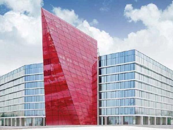 The red crystal structure at the centre deploys SEFAR® Architecture VISION fabric AL 260/55 printed, which gives glass a textile-like structural quality.