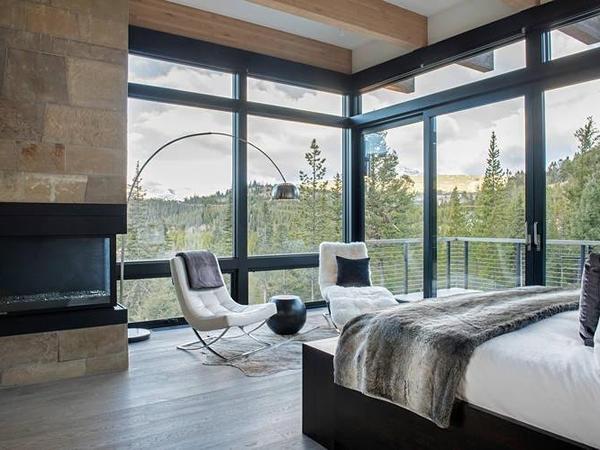 Architectural glass walls offering 360-degree views and insulation trending in resort areas