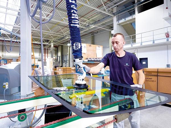 Marius Popescu prepares the sheet for the application of adhesive.