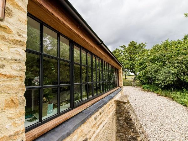 Cotswold architect uses steel windows for upgrade of listed farmhouse