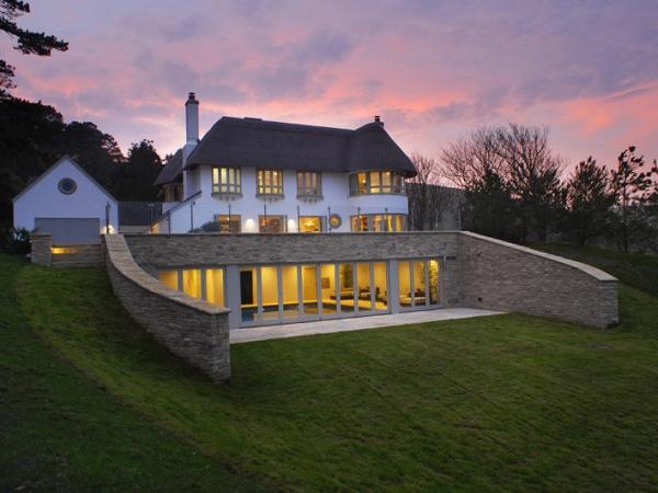 Rooflights installed in thatched coastal cottage for ventilation and access