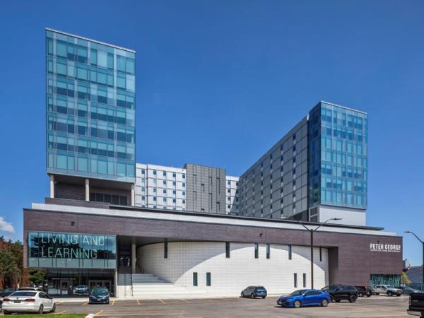 SOLARBAN® glass with acid-etched panels help university building function as mini-city