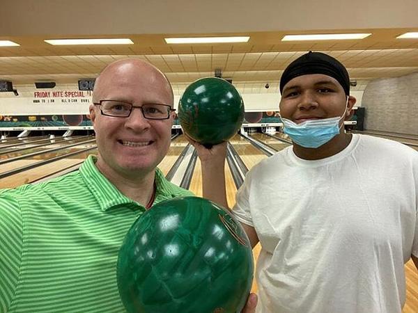 Chris Kammer, A+W Marketing Coordinator North America (left) along with Davison, a Big Brothers Big Sisters protégé, during a visit to the bowling center.