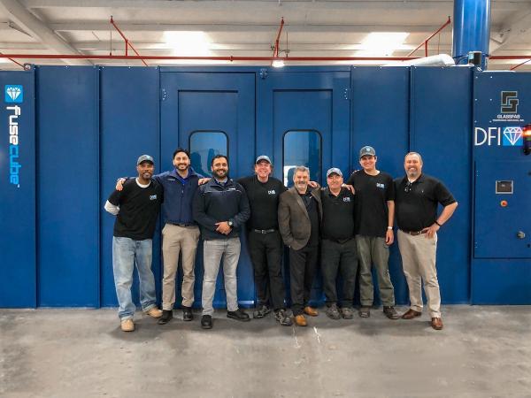 Glassfab and DFI team with FuseCube™ Flex 125 glass coating machine that automates application of Diamon-Fusion® glass treatment to shower doors, glass railings, IGUs, and much more