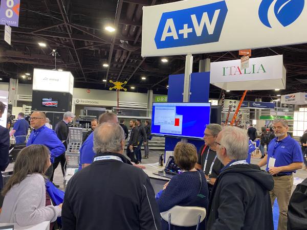 Dave Cox giving a demo to State Glass from Nebraska at GlassBuild 2023.