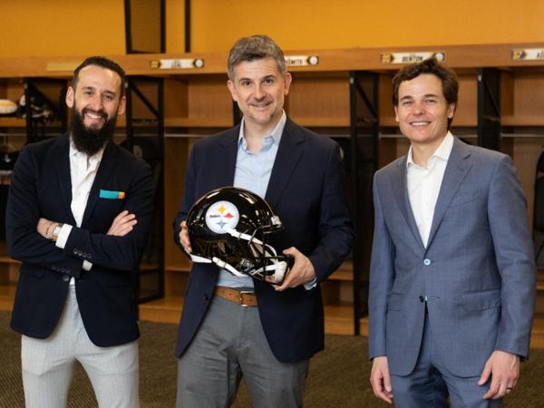 Vitro Architectural Glass Vice President of Marketing Fernando Diez (right), Maiz (center) and Sada (right) inside the Steelers locker room at Acrisure Stadium. (Photography: Ray Cordero, Mainline Photography)