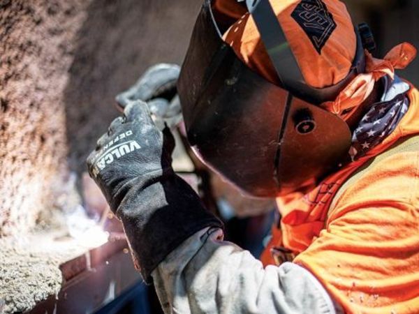 A Nortex Glass & Mirror employee wears a safety shield while working.