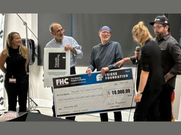 Andrew Haring, Representative of FHC, the Friese Foundation, and the Facade Tectonics Institute leadership, celebrating a $10,000 contribution supporting the Institute's mission.