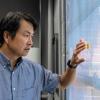 Kosol Kiatreungwattana examines temperature sensors on a window at the Denver Federal Center in Lakewood, Colorado, at a test area for emerging window technology. 